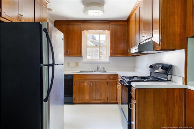 103 Stedman St, Fayetteville, NC 28305 - kitchen featuring black appliances, brown cabinets, light countertops, light floors, and under cabinet range hood