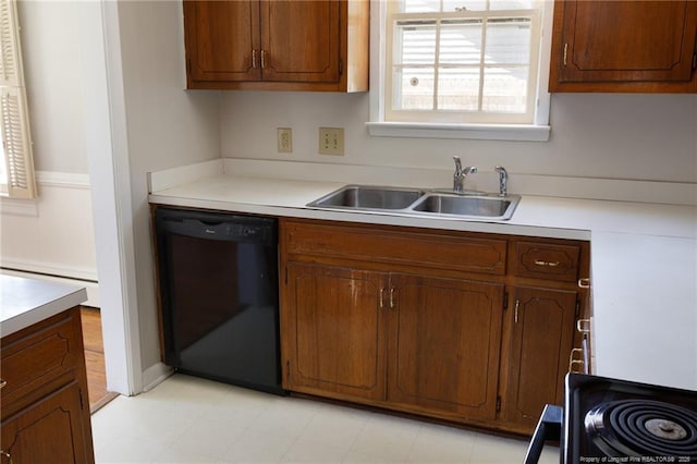 103 Stedman St, Fayetteville, NC 28305 - kitchen with dishwasher, a baseboard radiator, plenty of natural light, and light countertops
