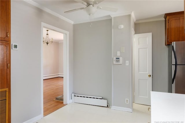 103 Stedman St, Fayetteville, NC 28305 - kitchen with a baseboard radiator, freestanding refrigerator, crown molding, ceiling fan, and brown cabinets