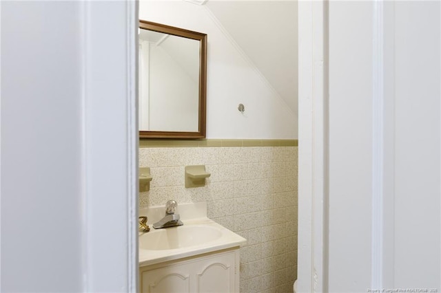 103 Stedman St, Fayetteville, NC 28305 - half bath featuring vanity, tile walls, and vaulted ceiling
