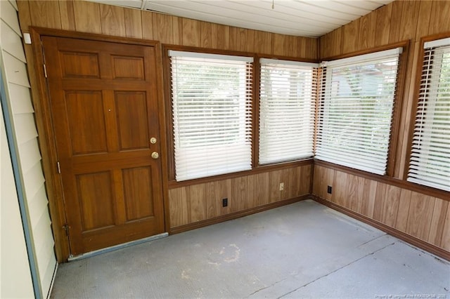 103 Stedman St, Fayetteville, NC 28305 - unfurnished sunroom featuring wooden walls, concrete floors, and plenty of natural light