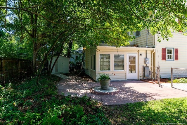 103 Stedman St, Fayetteville, NC 28305 - rear view of property with a storage shed and a patio