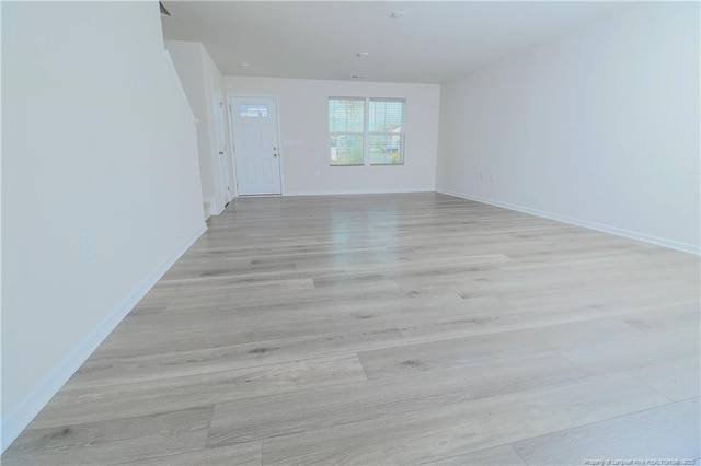 96 Cutty Way, Lillington, NC 27546 - spare room featuring light wood-style floors and baseboards