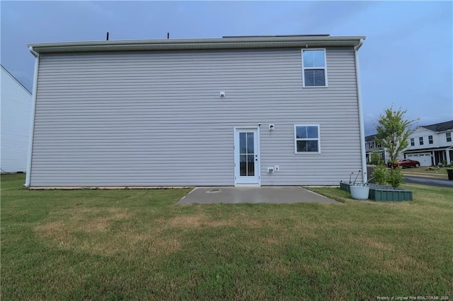 96 Cutty Way, Lillington, NC 27546 - back of property with a patio and a yard