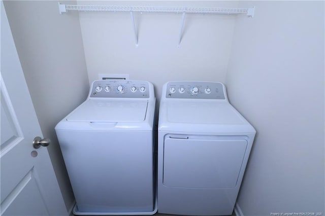 96 Cutty Way, Lillington, NC 27546 - laundry room featuring independent washer and dryer