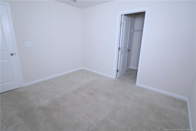 96 Cutty Way, Lillington, NC 27546 - unfurnished bedroom with carpet, a spacious closet, and a closet