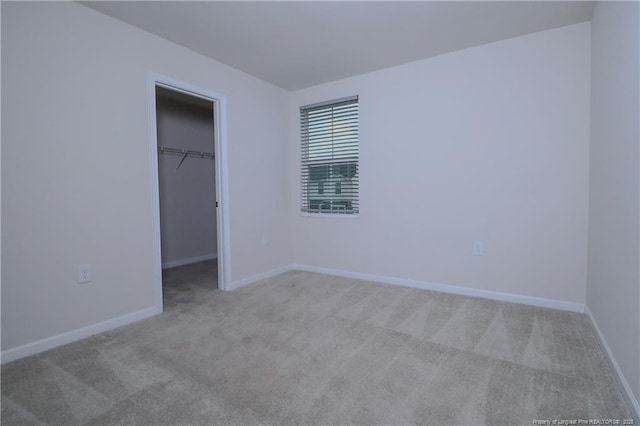 96 Cutty Way, Lillington, NC 27546 - unfurnished bedroom with carpet, a spacious closet, and a closet