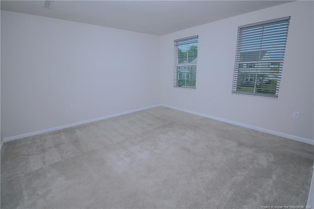 96 Cutty Way, Lillington, NC 27546 - empty room with carpet and baseboards