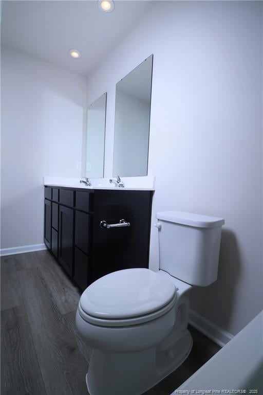 96 Cutty Way, Lillington, NC 27546 - bathroom with wood finished floors, vanity, and recessed lighting