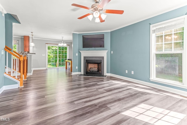 2555 Winding Creek Ln, Franklinton, NC 27525 - unfurnished living room featuring wood finished floors, ornamental molding, a fireplace with flush hearth, stairs, and ceiling fan