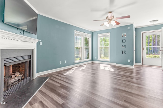 2555 Winding Creek Ln, Franklinton, NC 27525 - unfurnished living room featuring a ceiling fan, crown molding, a fireplace, and wood finished floors