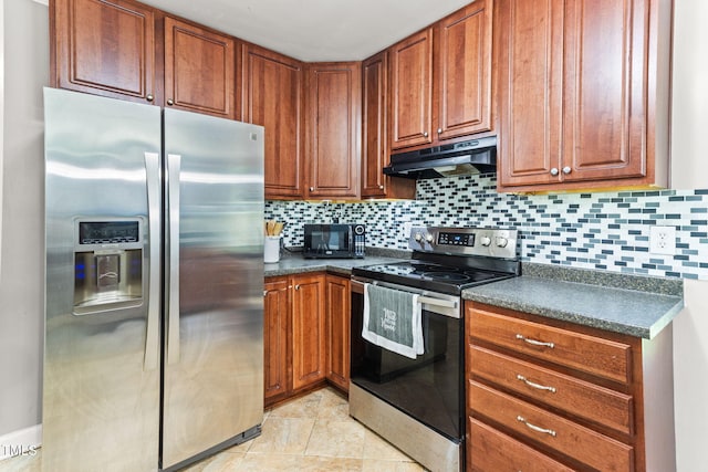 2555 Winding Creek Ln, Franklinton, NC 27525 - kitchen with stainless steel appliances, under cabinet range hood, dark countertops, and decorative backsplash