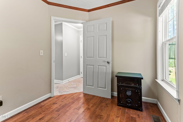 2555 Winding Creek Ln, Franklinton, NC 27525 - unfurnished bedroom with crown molding and hardwood / wood-style flooring