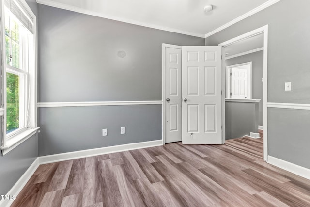 2555 Winding Creek Ln, Franklinton, NC 27525 - unfurnished bedroom featuring crown molding and wood finished floors