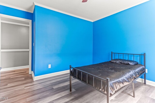 2555 Winding Creek Ln, Franklinton, NC 27525 - bedroom with ornamental molding, wood finished floors, and ceiling fan