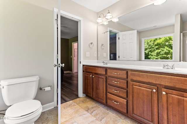 2555 Winding Creek Ln, Franklinton, NC 27525 - bathroom featuring double vanity and stone finish flooring