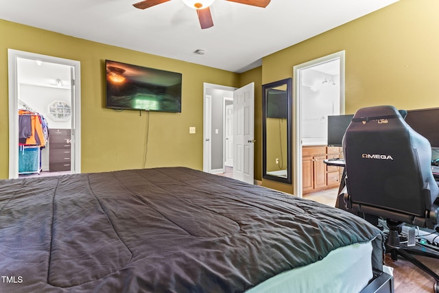 2555 Winding Creek Ln, Franklinton, NC 27525 - bedroom featuring connected bathroom, a desk, ceiling fan, and light wood-style floors