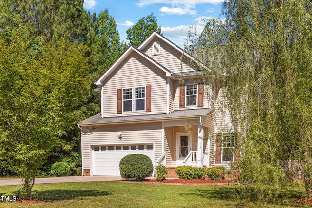 2555 Winding Creek Ln, Franklinton, NC 27525 - traditional-style home featuring a garage, concrete driveway, and a front lawn