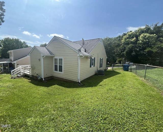 1819 Collier Rd, Durham, NC 27707 - view of side of property featuring a cooling unit and roof with shingles