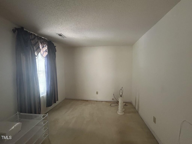 1819 Collier Rd, Durham, NC 27707 - spare room with light carpet and a textured ceiling