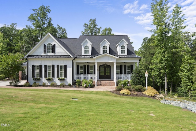 175 Stonecrest Way, Pittsboro, NC 27312 - view of front of home featuring a standing seam roof, covered porch, a front lawn, french doors, and a ceiling fan