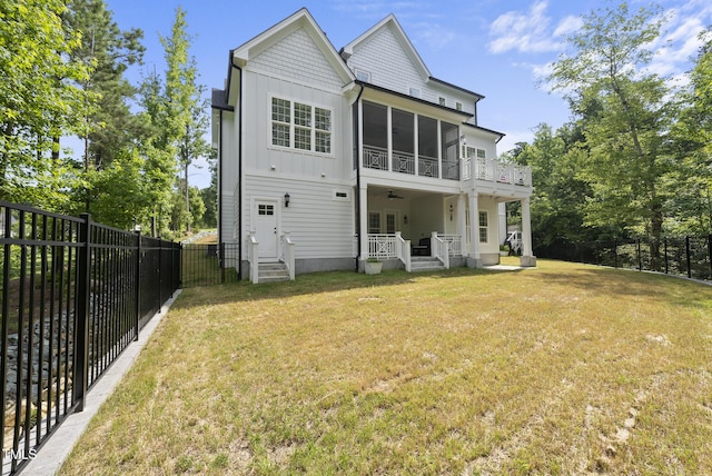 175 Stonecrest Way, Pittsboro, NC 27312 - rear view of house with board and batten siding, a fenced backyard, and a ceiling fan