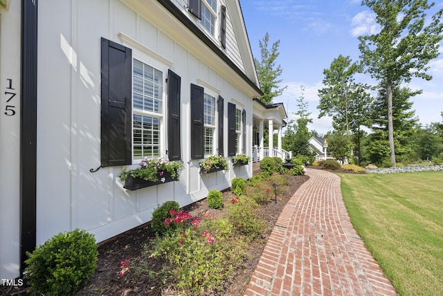 175 Stonecrest Way, Pittsboro, NC 27312 - view of home's exterior featuring board and batten siding, a lawn, and covered porch