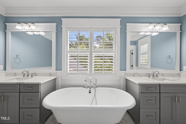 175 Stonecrest Way, Pittsboro, NC 27312 - bathroom featuring two vanities, a soaking tub, crown molding, and marble finish floors