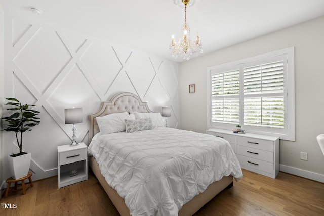 175 Stonecrest Way, Pittsboro, NC 27312 - bedroom featuring a chandelier and light wood finished floors