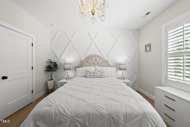 175 Stonecrest Way, Pittsboro, NC 27312 - bedroom with wood finished floors and a chandelier