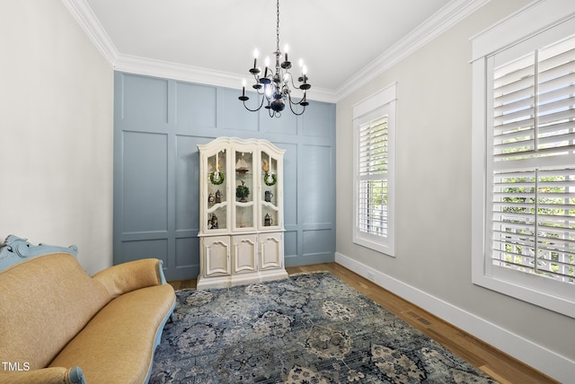 175 Stonecrest Way, Pittsboro, NC 27312 - living area featuring a chandelier, ornamental molding, and wood finished floors