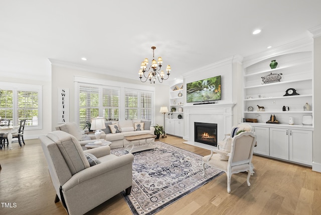 175 Stonecrest Way, Pittsboro, NC 27312 - living room featuring crown molding, a fireplace with flush hearth, a chandelier, light wood-style flooring, and recessed lighting