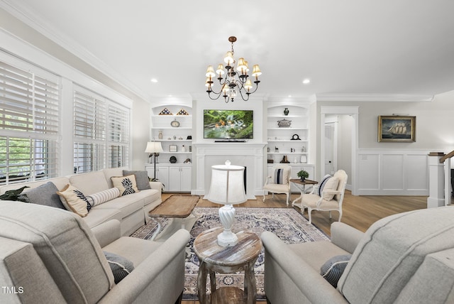 175 Stonecrest Way, Pittsboro, NC 27312 - living area featuring a chandelier, light wood-style floors, ornamental molding, a wainscoted wall, and recessed lighting