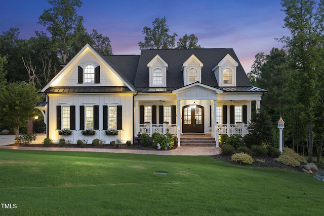 175 Stonecrest Way, Pittsboro, NC 27312 - view of front of property featuring french doors, a standing seam roof, covered porch, board and batten siding, and a yard