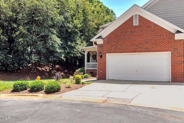 1120 Fairway Villas Dr, Wake Forest, NC 27587 - view of front of home featuring brick siding, driveway, and an attached garage