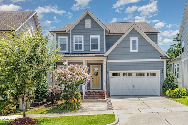 664 Old Dairy Dr, Wake Forest, NC 27587 - view of front of home with driveway, an attached garage, a shingled roof, and a porch