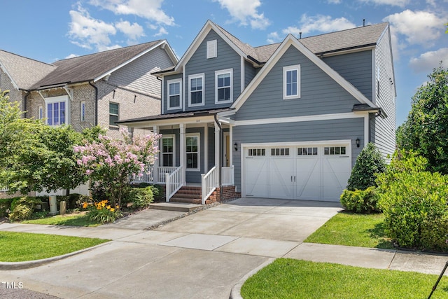 664 Old Dairy Dr, Wake Forest, NC 27587 - view of front facade featuring covered porch, driveway, and a garage