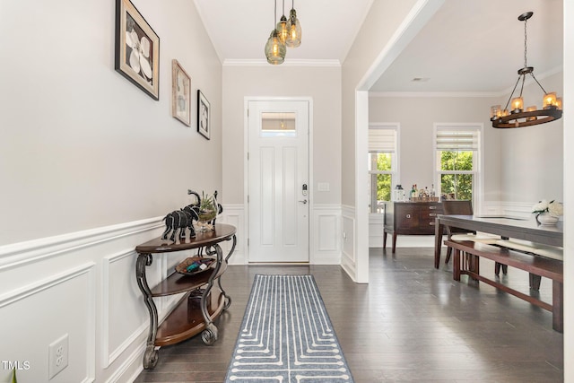 664 Old Dairy Dr, Wake Forest, NC 27587 - entrance foyer featuring a chandelier, ornamental molding, wainscoting, a decorative wall, and dark wood-style flooring