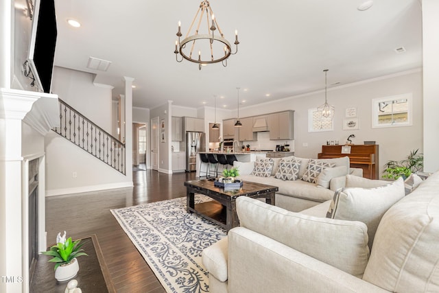 664 Old Dairy Dr, Wake Forest, NC 27587 - living area with a chandelier, dark wood-style flooring, crown molding, recessed lighting, and a fireplace with flush hearth