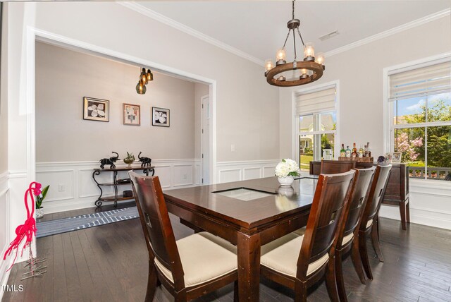 664 Old Dairy Dr, Wake Forest, NC 27587 - dining area with a chandelier, ornamental molding, a wainscoted wall, dark wood finished floors, and a decorative wall