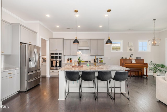664 Old Dairy Dr, Wake Forest, NC 27587 - kitchen with appliances with stainless steel finishes, a kitchen breakfast bar, gray cabinetry, dark wood finished floors, and light stone counters