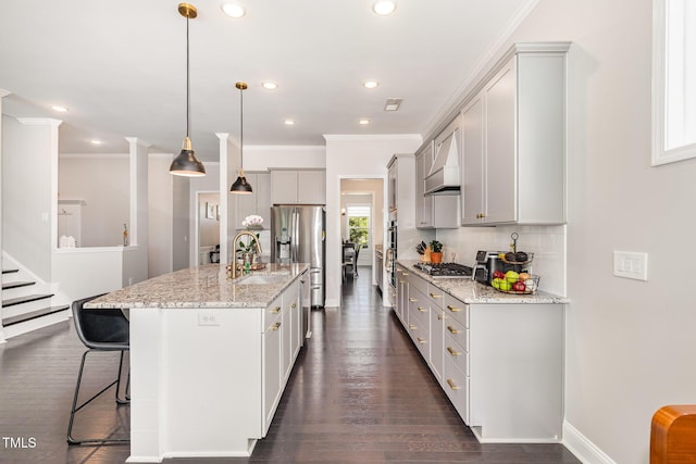 664 Old Dairy Dr, Wake Forest, NC 27587 - kitchen with appliances with stainless steel finishes, ornamental molding, custom exhaust hood, a kitchen bar, and tasteful backsplash