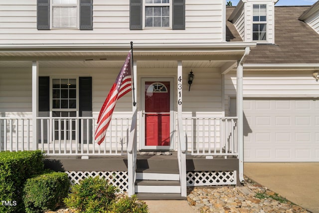 4316 Major Loring Way, Raleigh, NC 27616 - property entrance featuring a porch, roof with shingles, and concrete driveway