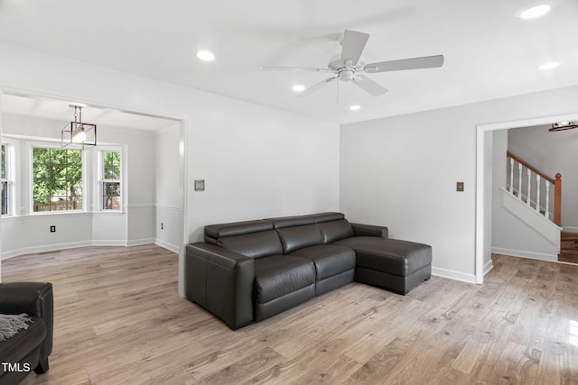 4316 Major Loring Way, Raleigh, NC 27616 - living area with light wood finished floors, stairs, a ceiling fan, and recessed lighting