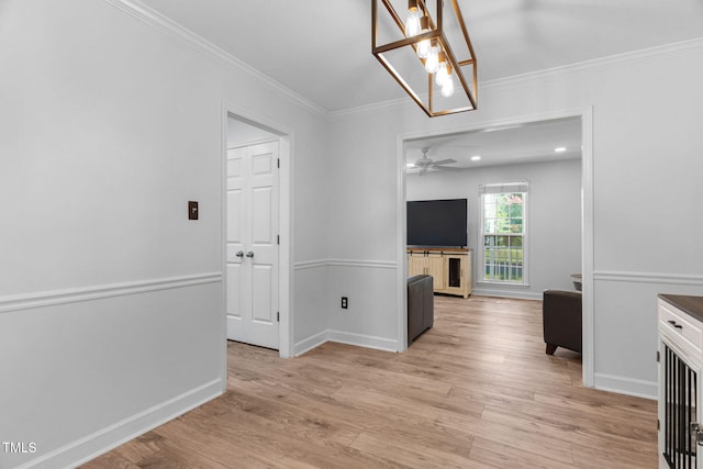 4316 Major Loring Way, Raleigh, NC 27616 - unfurnished living room featuring light wood finished floors, ornamental molding, and a ceiling fan