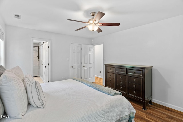 4316 Major Loring Way, Raleigh, NC 27616 - bedroom featuring wood finished floors, ceiling fan, and ensuite bath