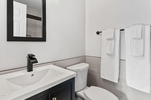 4316 Major Loring Way, Raleigh, NC 27616 - bathroom featuring tile walls, vanity, wainscoting, and a shower
