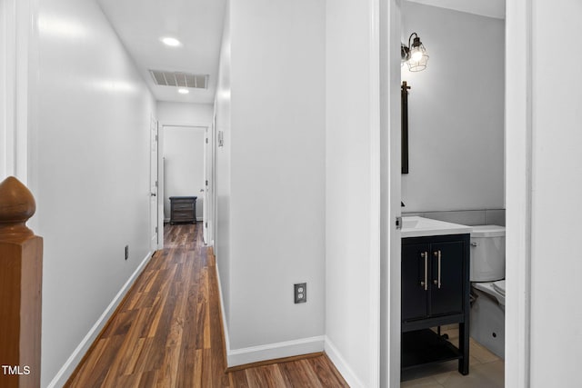 4316 Major Loring Way, Raleigh, NC 27616 - hallway featuring wood finished floors and recessed lighting