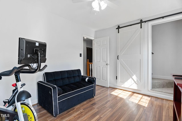 4316 Major Loring Way, Raleigh, NC 27616 - exercise area featuring wood finished floors, a barn door, and a ceiling fan