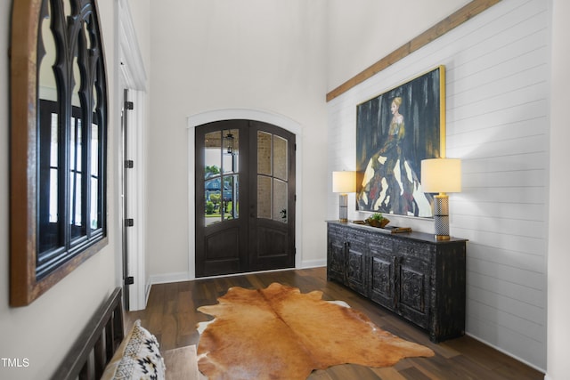 241 Teague St, Wake Forest, NC 27587 - foyer with arched walkways, french doors, wood finished floors, wooden walls, and a high ceiling